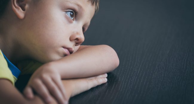 Portrait of one sad little boy. Concept of sorrow.